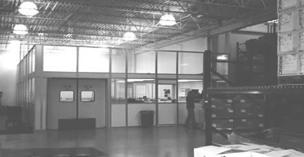 modular glass room divider in commercial setting